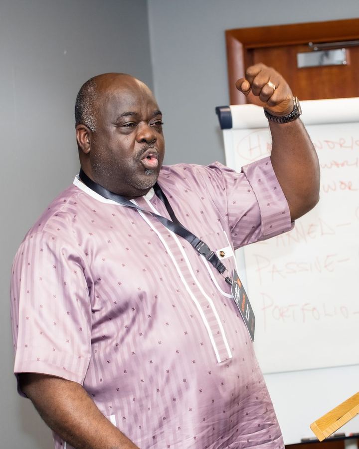 Dr. Olumide Emmanuel on stage in Milton Keynes